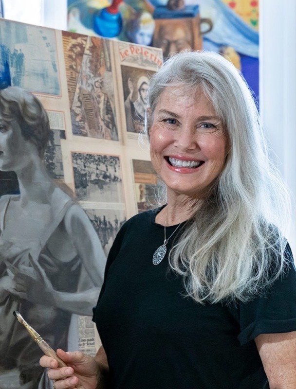 The founder of Women of Resistance beside her artwork