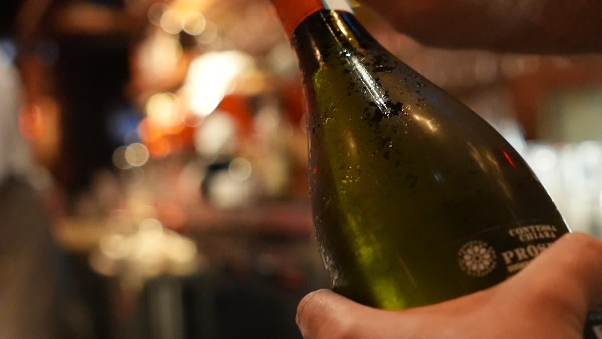 A wine pour at the bar at 1592 Wood Fired, Sarasota, mid-service