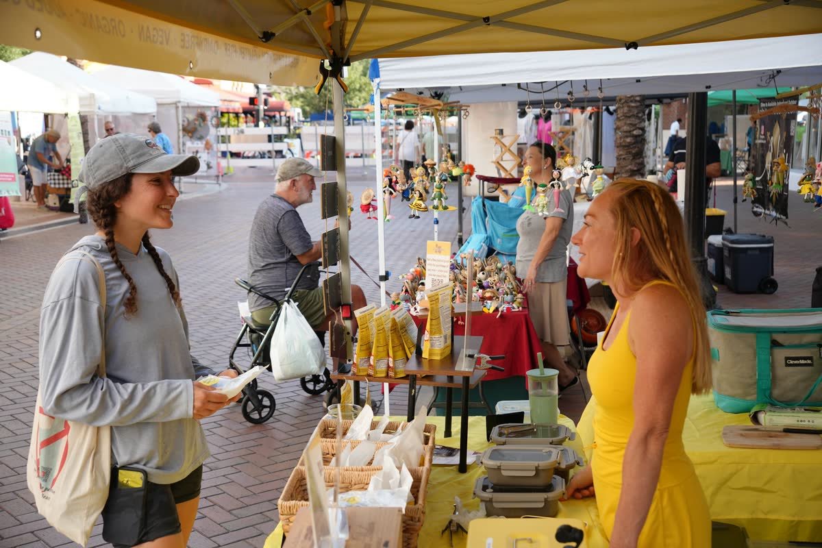 Jordan of Beanie Bites at the Sarasota Farmers Market stall during a Siesta Media shoot day