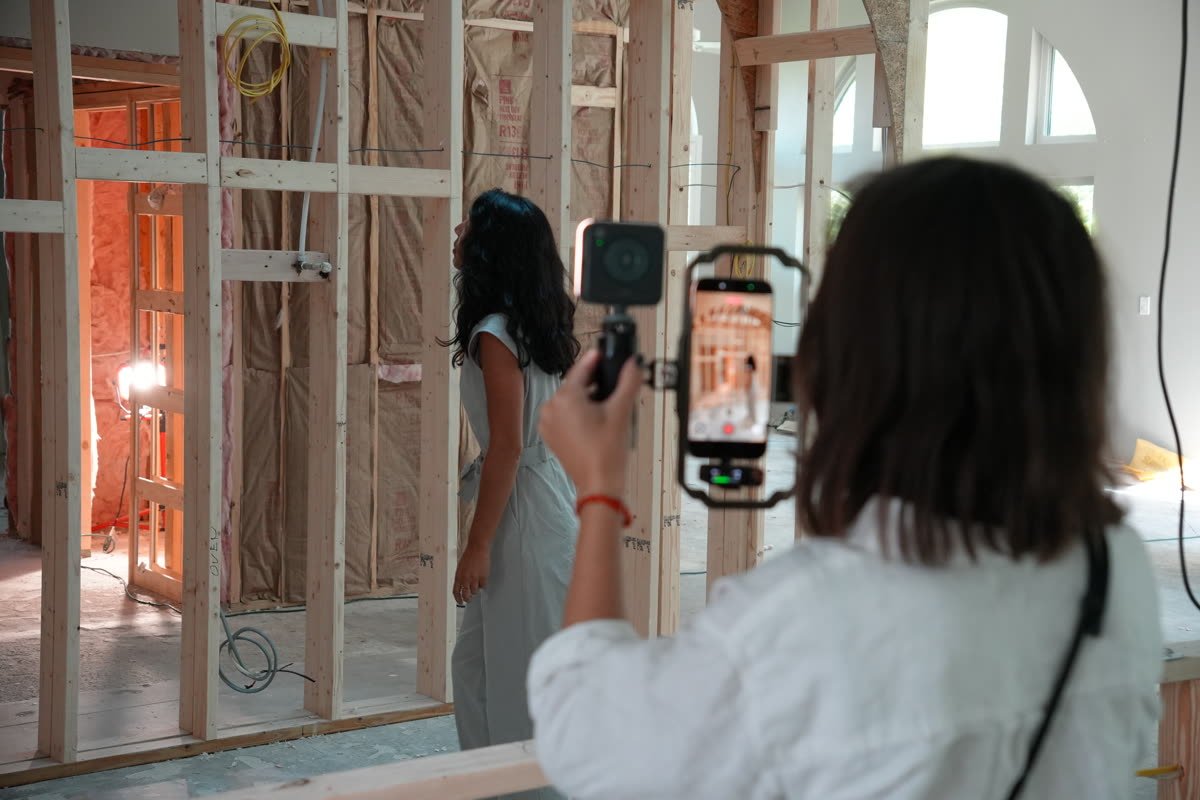 Siesta Media filming a walkthrough inside a Sarasota home under construction for a short-form video